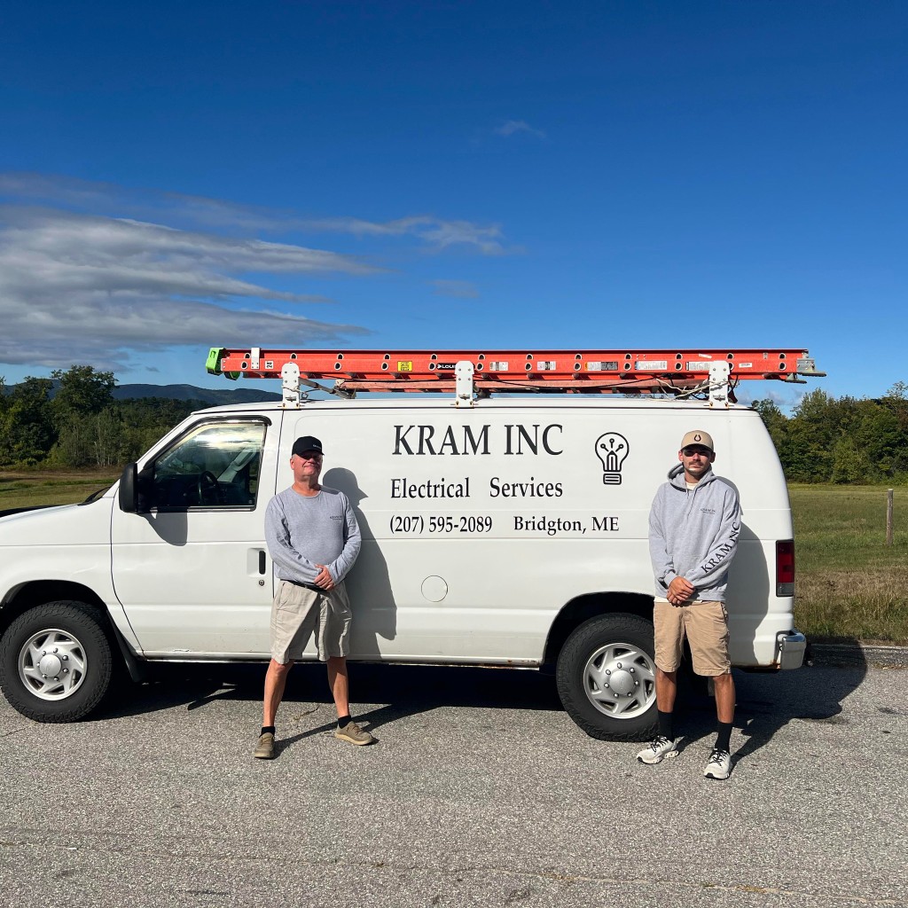 KRAM Inc. team standing by branded service van