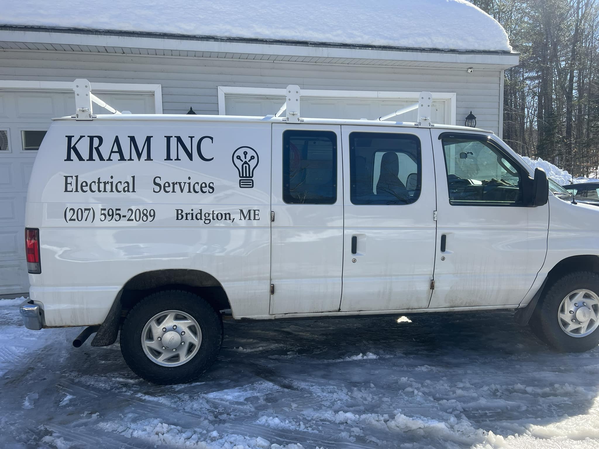 KRAM Inc. branded van in winter driveway